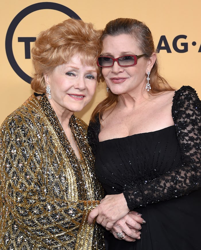 Debbie Reynolds and Carrie Fisher posing at a red carpet event