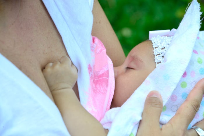 A woman with d-mer breastfeeding her baby
