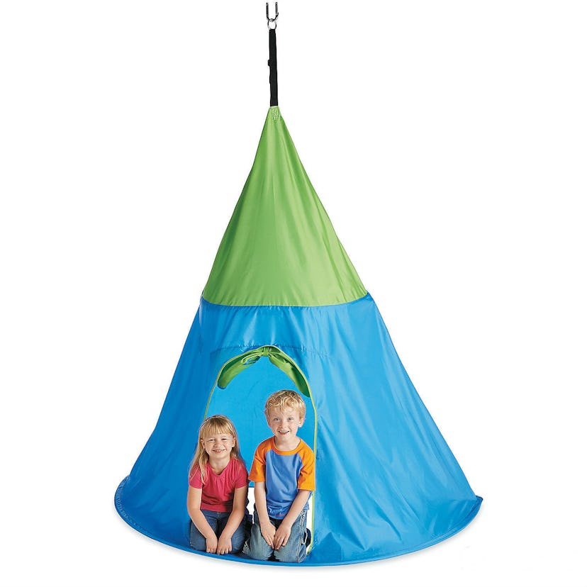 Two kids sitting in a hang-a-fort with LED lights