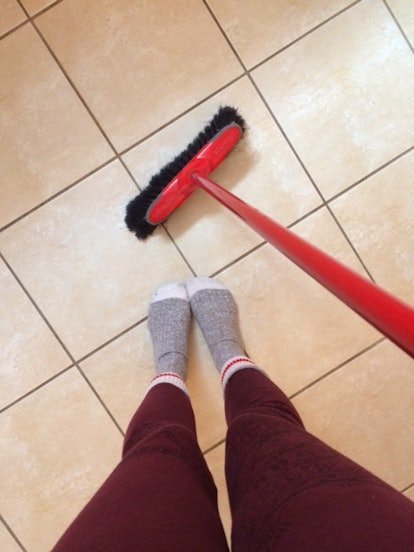 Ceilidhe Wynn sweeping the floor