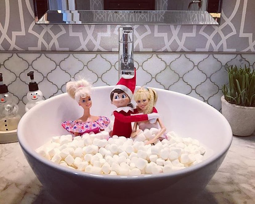 elf on the shelf in mini marshmallow bath with two barbies as an NSFW elf on the shelf idea for adul...