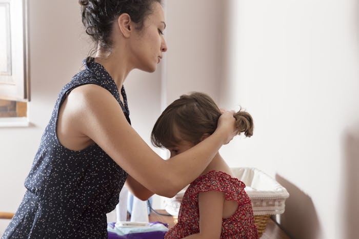 A mom getting ready with her little daughter in the morning