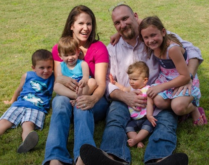 Family photo of Emily Hall, her husband, and four kids