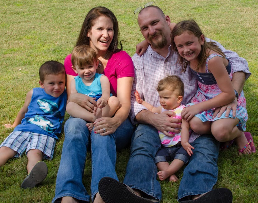 Family photo of Emily Hall, her husband, and four kids