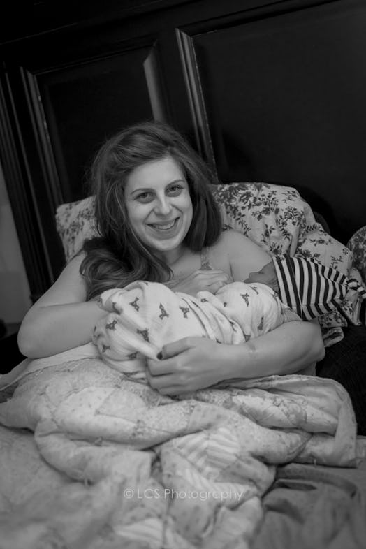 A mother holding her newborn after the home birth