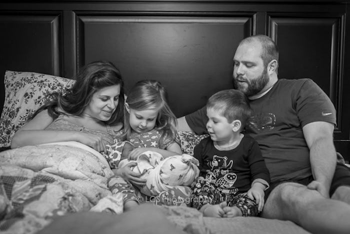 A family with their newborn after home birth