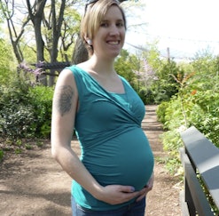 Skinny-shamed pregnant woman posing for a photo