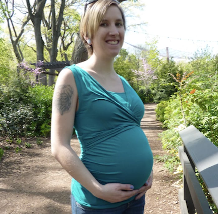 Skinny-shamed pregnant woman posing for a photo