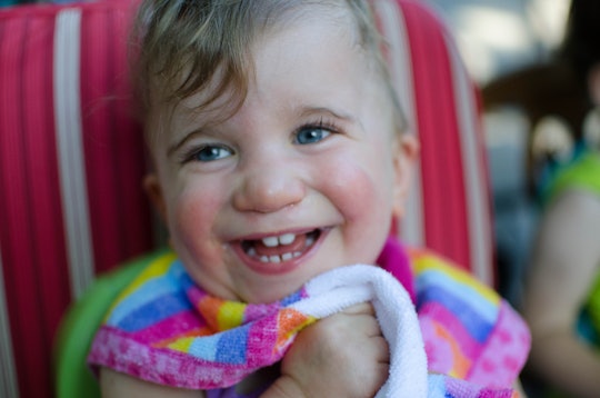Baby girl with Ogden Syndrome smiling