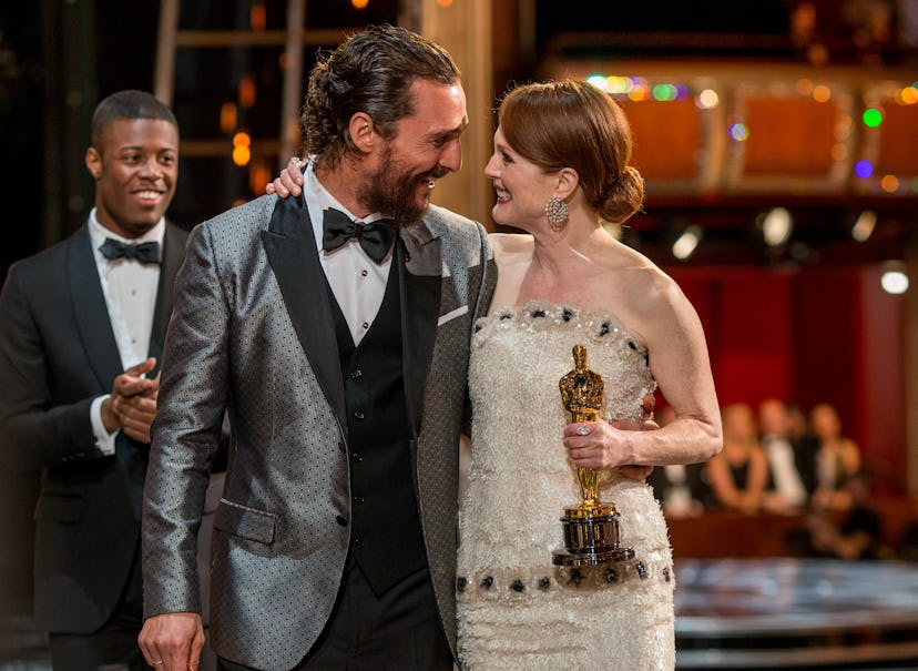 Matthew McConaughey hugs Julianne Moore at the 87th Annual Academy Awards 