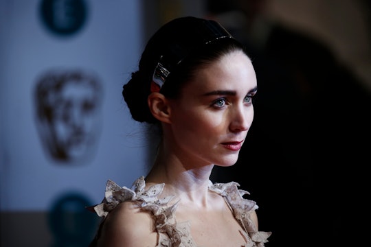 A closeup of Rooney Mara at the Oscars with her hair in a bun 