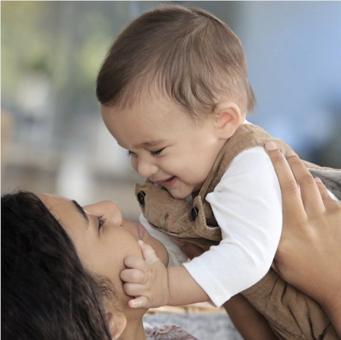 A mother holding and hugging her child