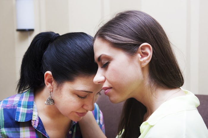 Two women ending a fight in a calm way
