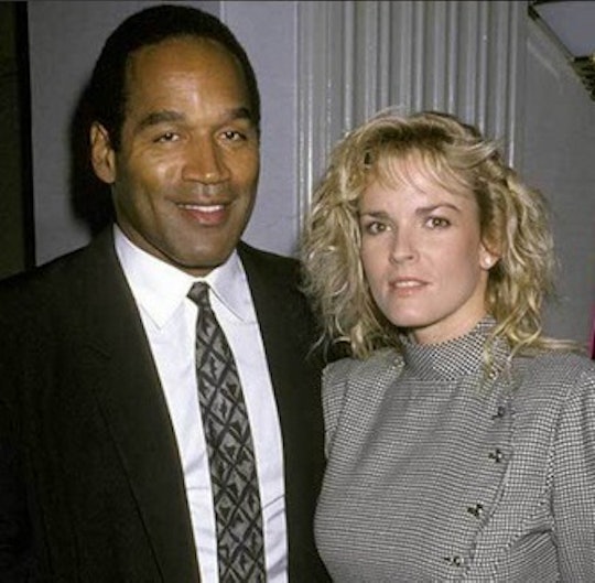 O.J. Simpson and Nicole Brown Simpson posing in their home