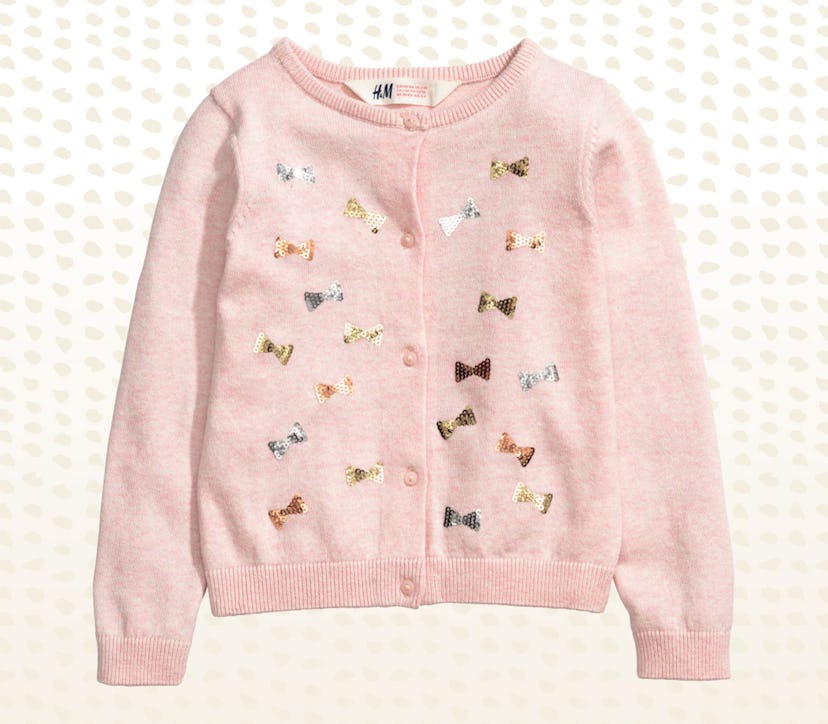 A pink H&M cotton cardigan with gold and glittery dragonflies