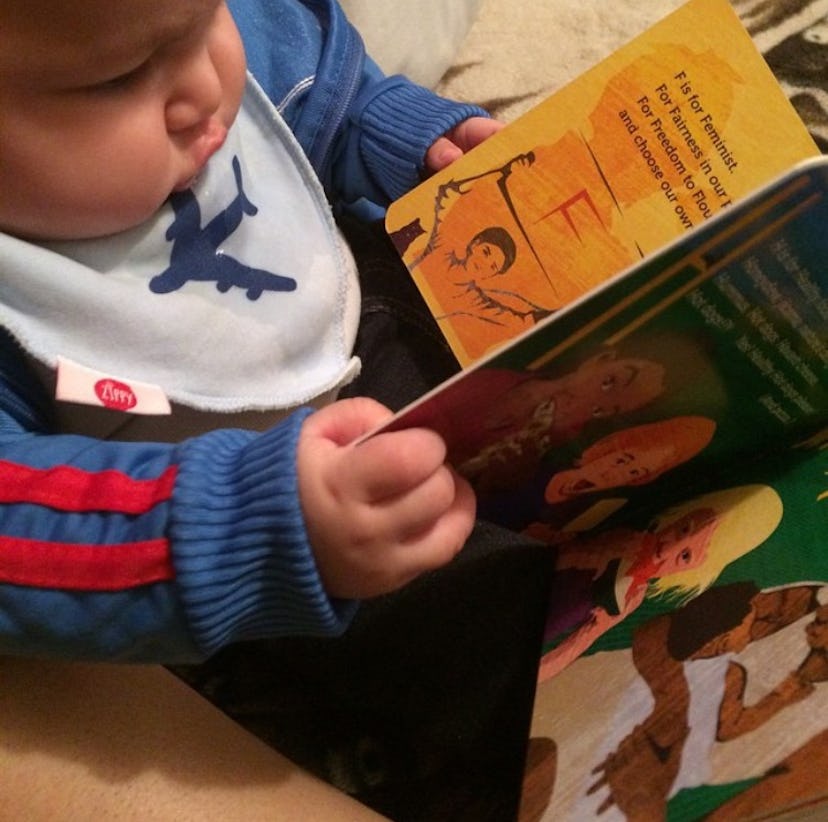 Mexican-American baby reading a bilingual book