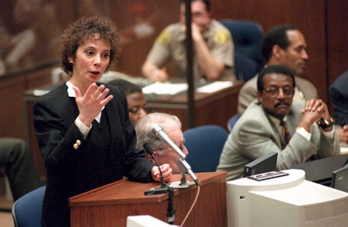 Johnnie Cochran and Marcia Clark sitting in a courtroom