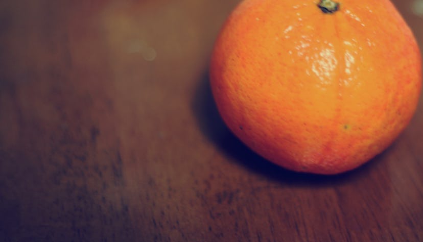 A tangerine on the table