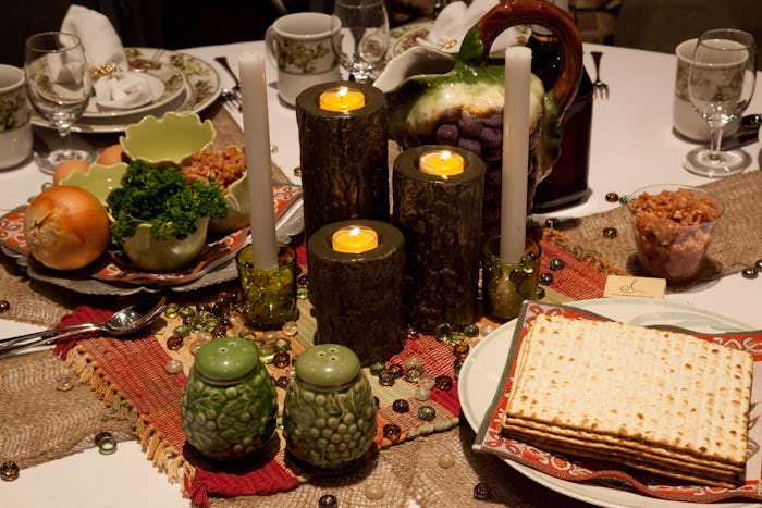 A table with candles and meal plates