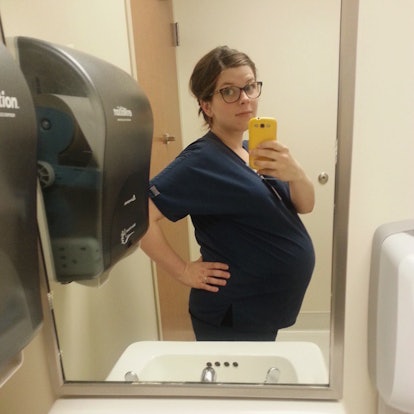 Mary Sauer taking a mirror selfie in the bathroom while pregnant