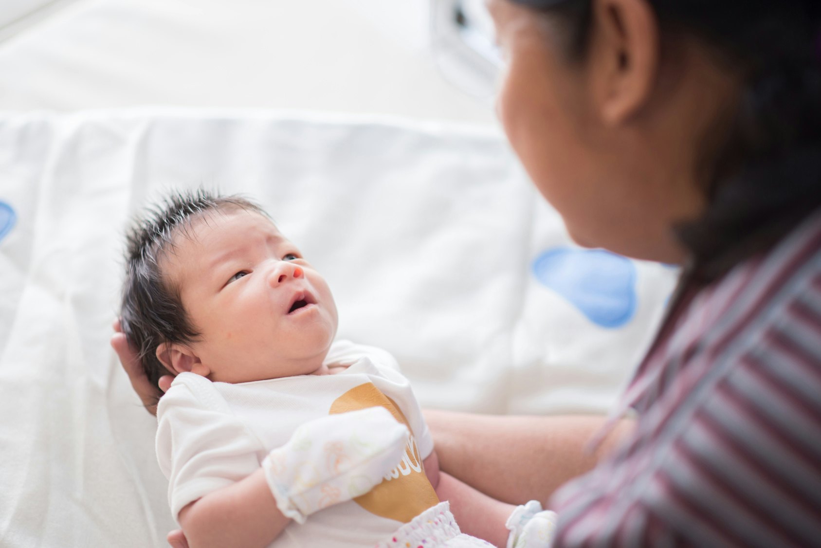 baby looking at mom