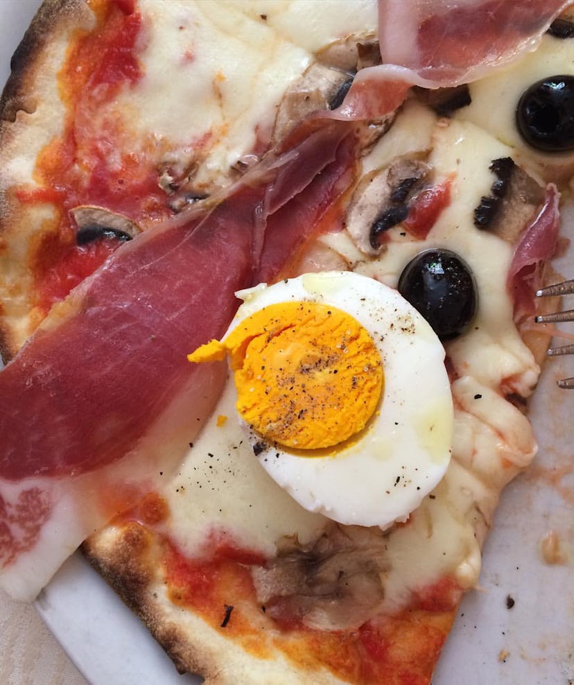 Egg and bacon on a pizza