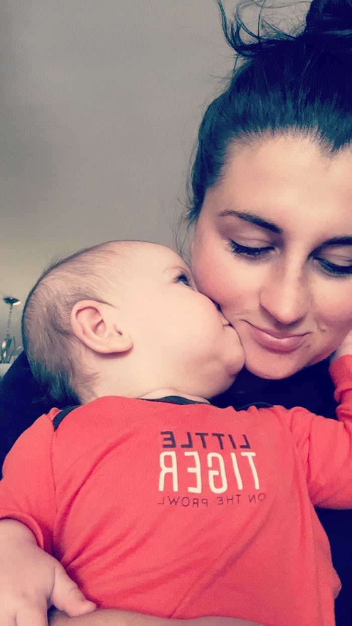 Haley DePass with her son getting a kiss on the cheek