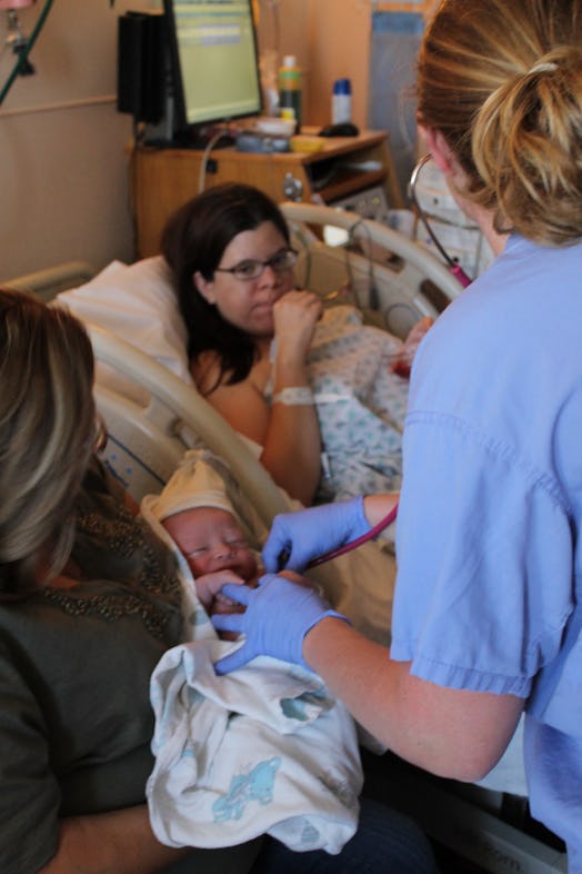Samantha Taylor after labor while her mother holds her baby