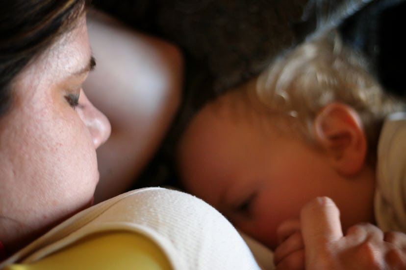 Samantha lying and breastfeeding her son