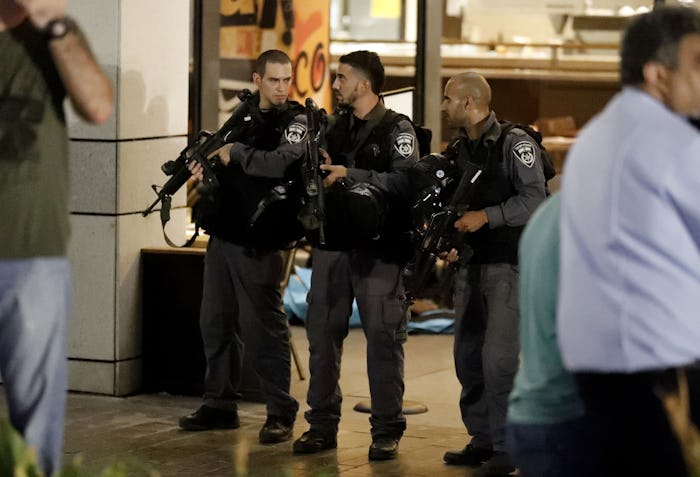 Armed Police officers at the Tel Aviv shooting scene