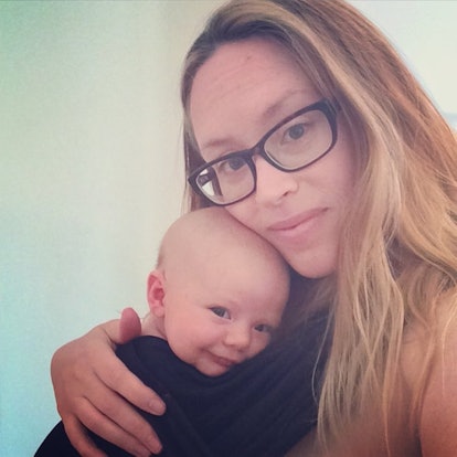 Stephanie Baroni-Cook hugging her baby