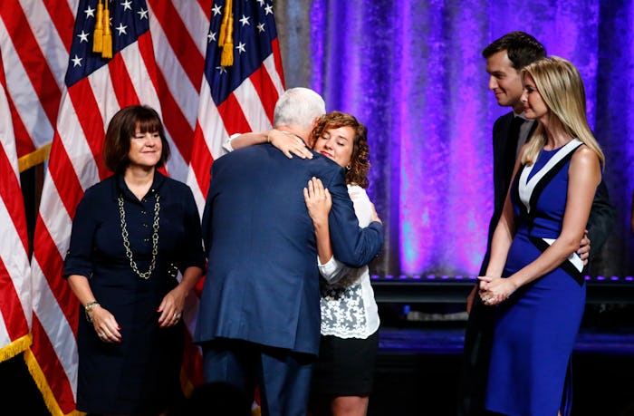 Mike Pence hugging his daughter Charlotte Pence while his wife Karen is standing next to them