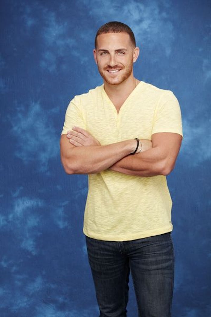 Vinny from The Bachelorette in a yellow tee on a blue background