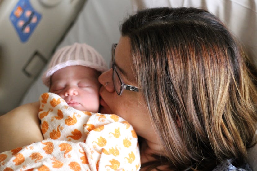 Samantha Taylor kissing her baby 