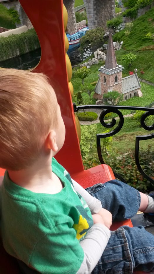 Christi's son enjoys an amusement park attraction