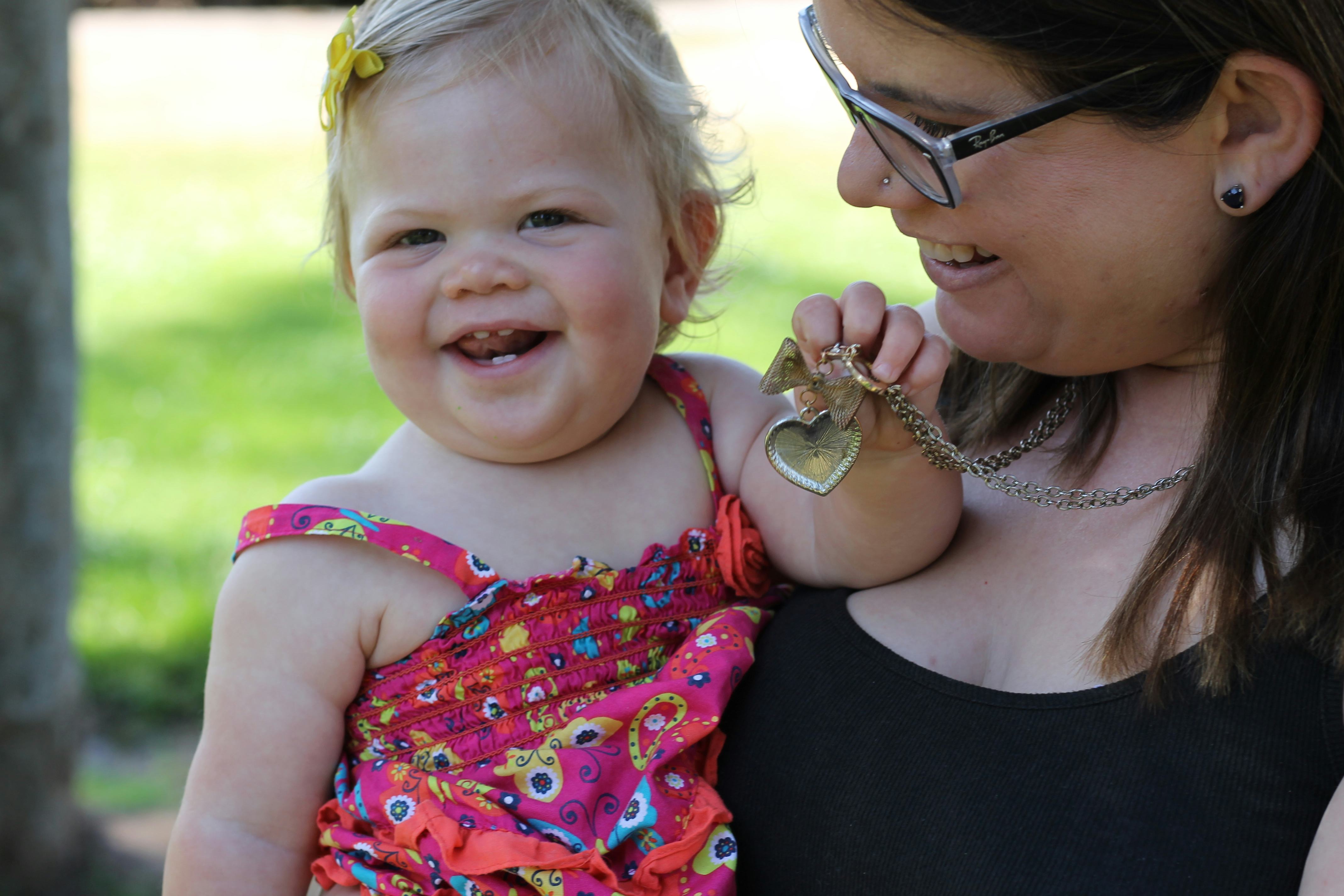 A woman, who cared about the sex of her baby, holding her daughter as both are smiling