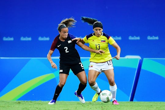 Mallory Pugh #2 of the United States and Angela Clavijo #13 of Colombia racing for the ball