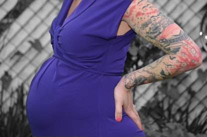 Pregnant Kimberly Zapata wearing a blue dress
