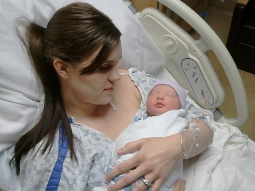 Christi Cazin in a hospital holding her newborn son