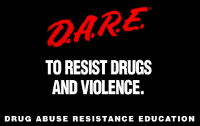 A poster for D.A.R.E. with their slogan "to resist drugs and violence" in white and "D.A.R.E." in re...