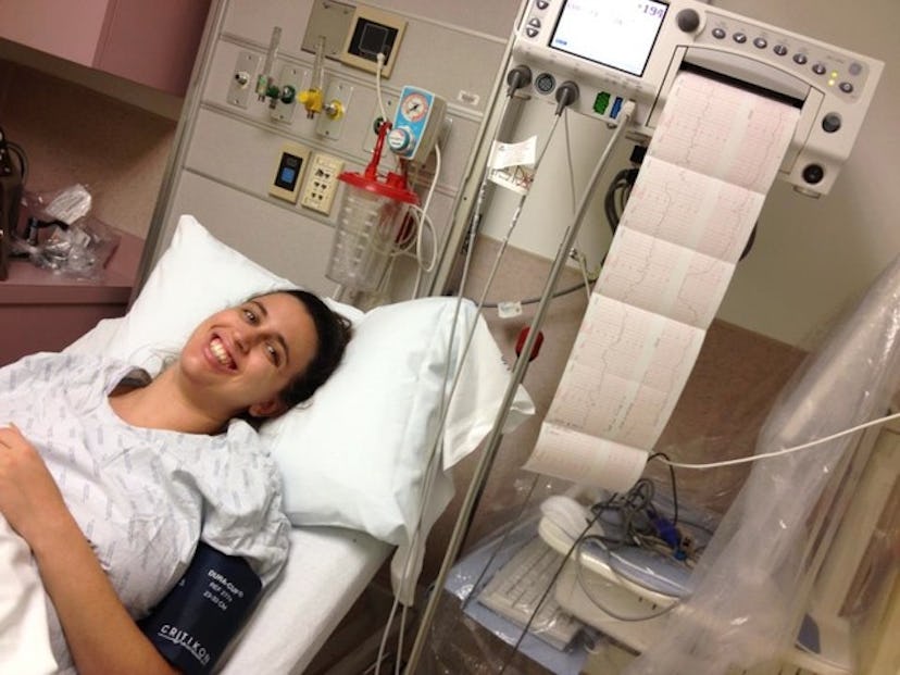 Mariah MacCarthy lying in a hospital bed