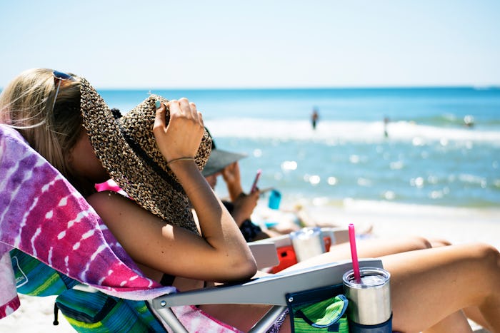 A lazy mom lying on a beach