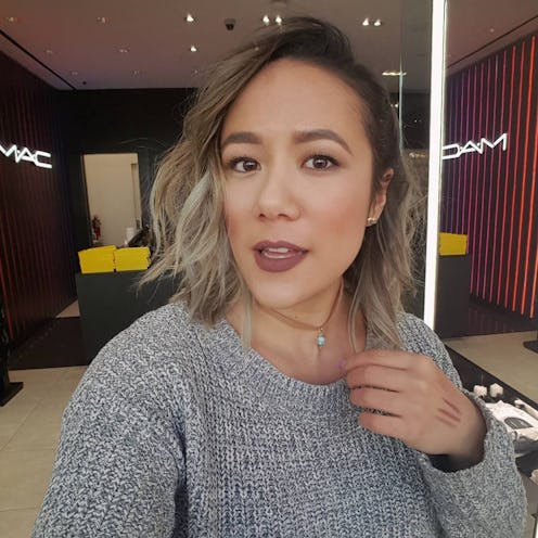 A blonde woman that stopped saying sorry taking a selfie