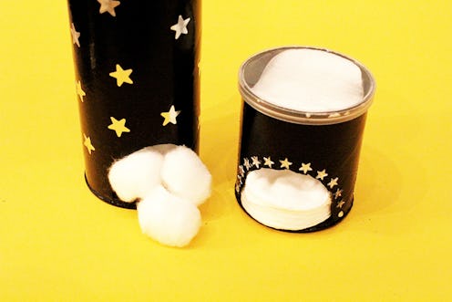 DIY makeup pad dispensers in black decorated with golden-colored stars