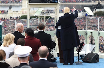 Donald Trump at his inauguration, shot taken from his back depicting the audience at the front.