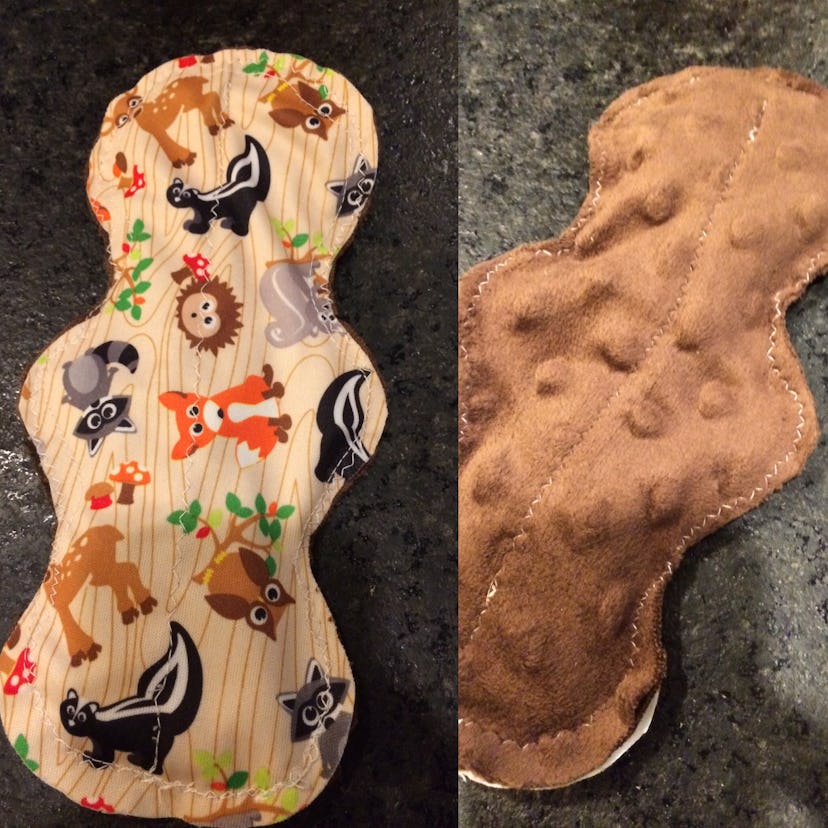 A homemade menstrual pad with one side brown and the other in animal print. 