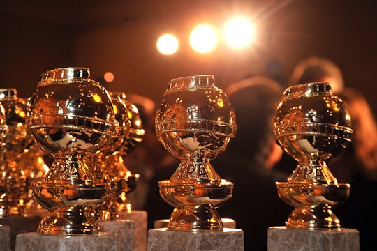 Several Golden Globes award sculptures places next to each other