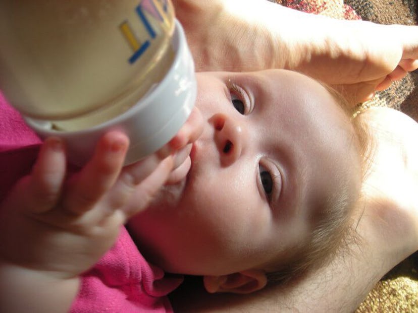 Baby eating from a bottle