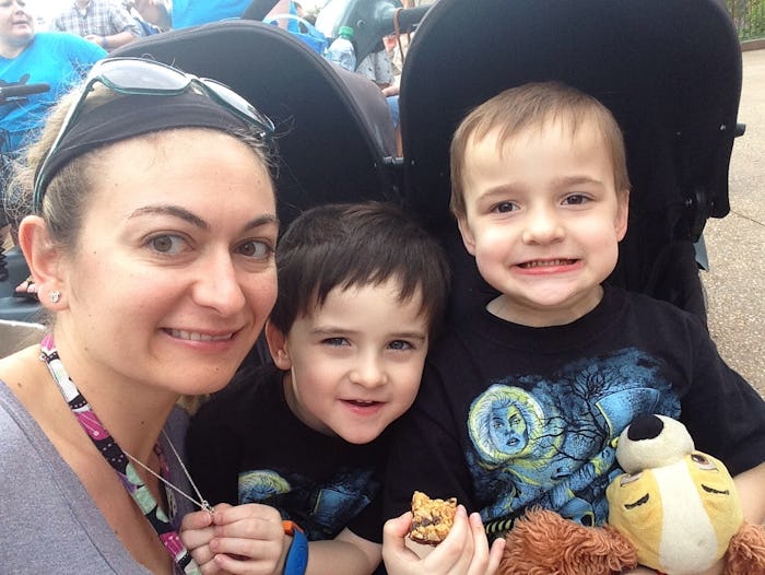 A woman taking a selfie with two little boys
