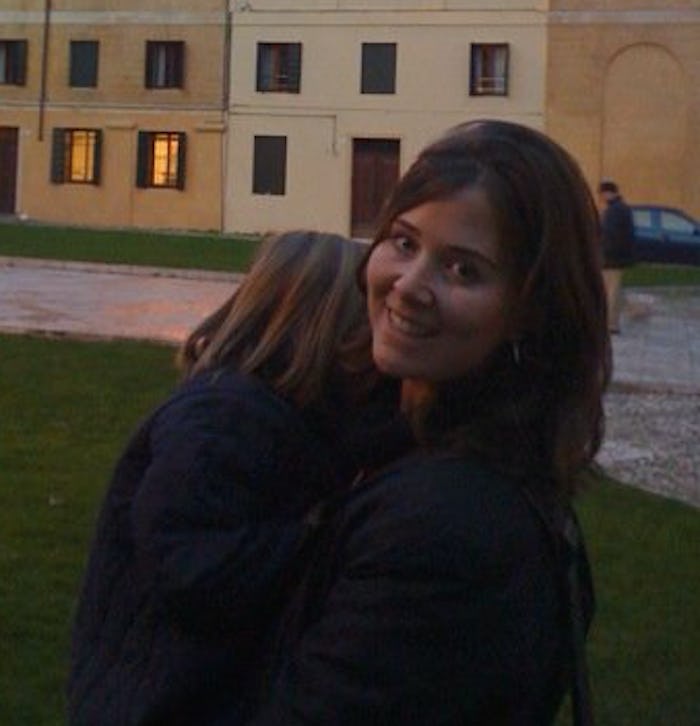 Samantha Shanley standing outside holding her daughter